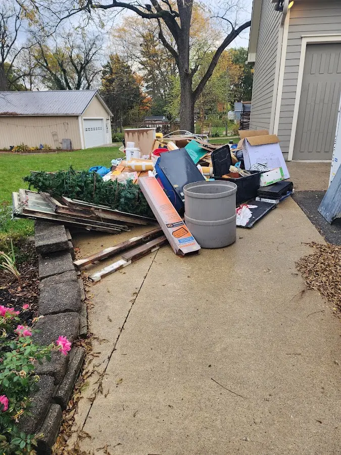 Dumpster being loaded with debris for 10 Yard Dumpster Rental in Rockwood